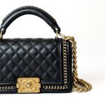 Chanel Boy Top Handle Flap Bag in Black Lambskin with Gold-Tone Hardware - Image 2