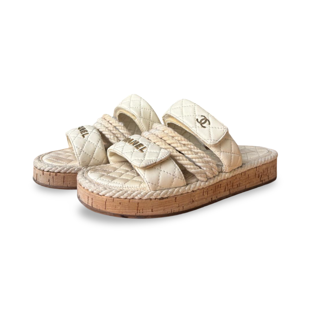 WhatsApp Image 2025-12-16 at 13.10.09_6c617537 Chanel White Logo Cord Quilted Slide Sandals – Size 38C - Image 1